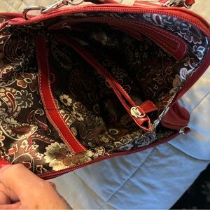 Cranberry colored convertible handbag